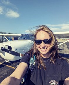 Flight student conducting pre-flight inspection on training aircraft at California Flight School